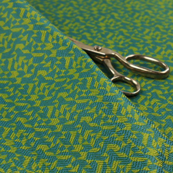 This fabric has a small, repeated geometric pattern in lime green and blue.