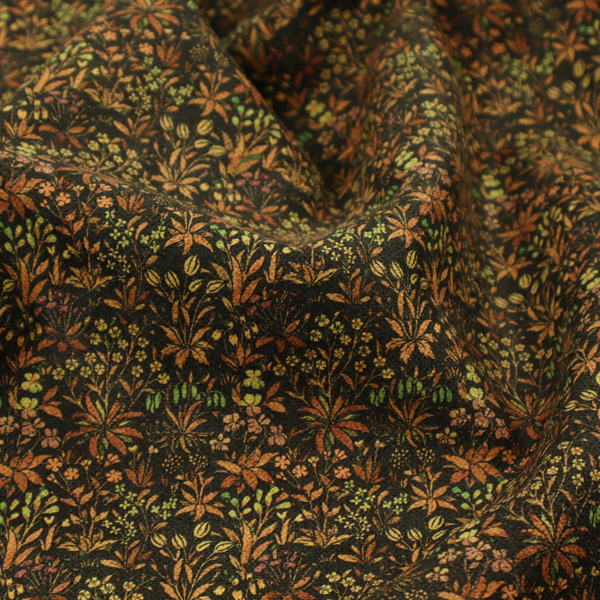 This fabric has a forest/floral design in different warm tones with accents of green foliage.