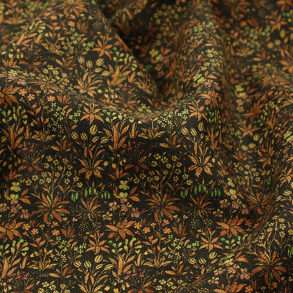 This fabric has a forest/floral design in different warm tones with accents of green foliage.
