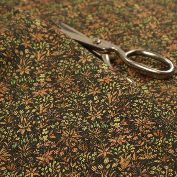 This fabric has a forest/floral design in different warm tones with accents of green foliage.
