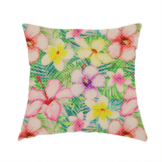 The fabric used to create this handmade cushion is a vibrant tropical fabric pattern featuring pink and purple hibiscus flowers, yellow plumeria, and green palm leaves on a light grey dotted background.