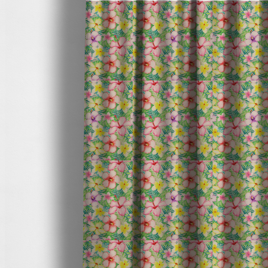 The fabric used to create these made-to-measure curtains is a vibrant tropical fabric pattern featuring pink and purple hibiscus flowers, yellow plumeria, and green palm leaves on a light grey dotted background.