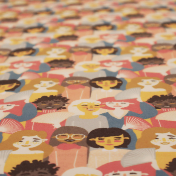 A whimsical, repeating fabric pattern featuring illustrated portraits of women with diverse hairstyles and accessories, some holding white hand fans, set against a warm coral-pink background.