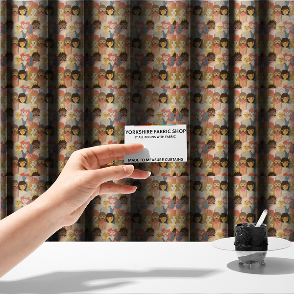 The fabric used to create these made-to-measure curtains is a whimsical, repeating fabric pattern featuring illustrated portraits of women with diverse hairstyles and accessories, some holding white hand fans, set against a warm coral-pink background.