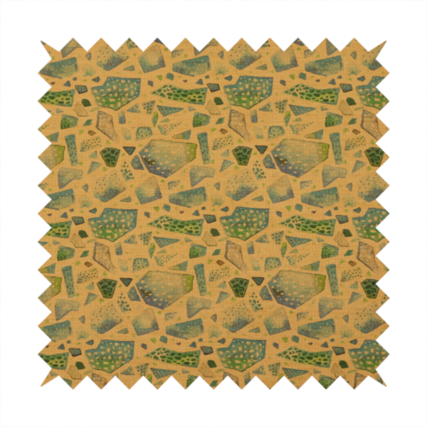 An earthy, abstract fabric pattern featuring organic mosaic shapes in moss green, teal, and slate grey on a textured mustard yellow background.