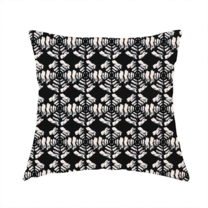 The fabric used to create this handmade cushion is a bold, monochrome fabric pattern featuring a repeating hand-inked radial geometric design in cream on a solid black background.