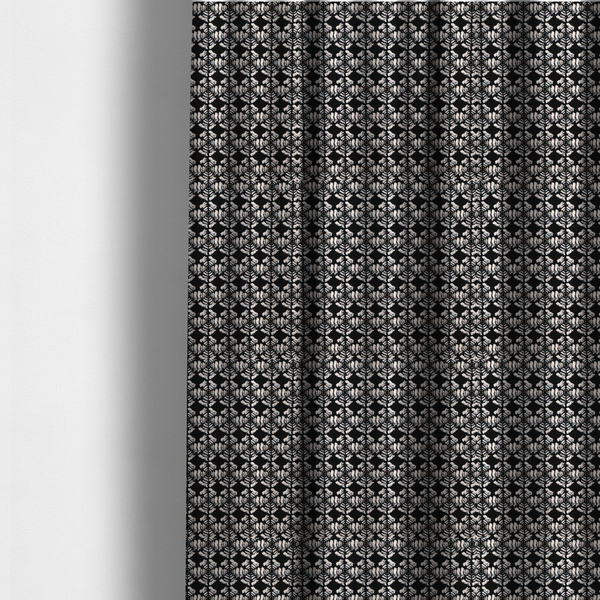 The fabric used to create these made-to-measure curtains is a bold, monochrome fabric pattern featuring a repeating hand-inked radial geometric design in cream on a solid black background.