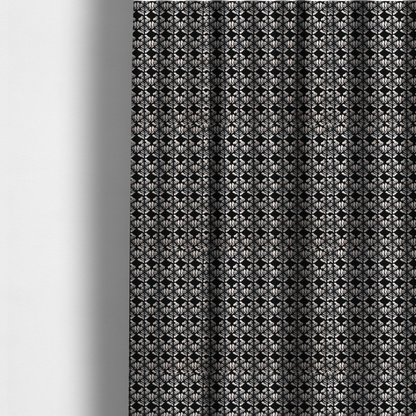 The fabric used to create these made-to-measure curtains is a bold, monochrome fabric pattern featuring a repeating hand-inked radial geometric design in cream on a solid black background.