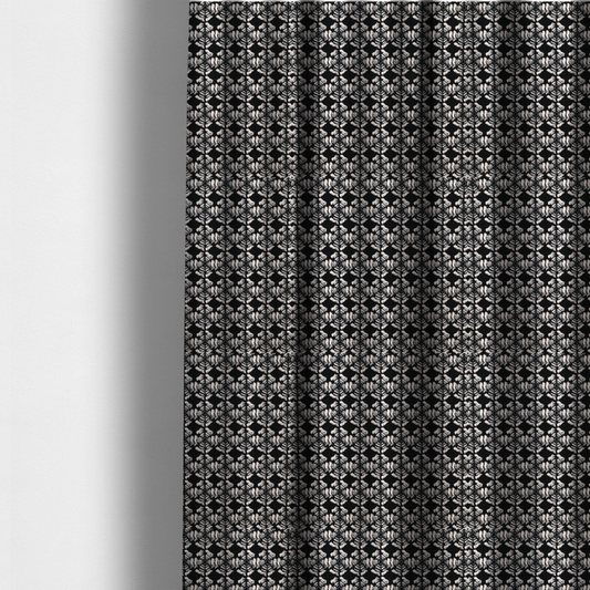 The fabric used to create these made-to-measure curtains is a bold, monochrome fabric pattern featuring a repeating hand-inked radial geometric design in cream on a solid black background.