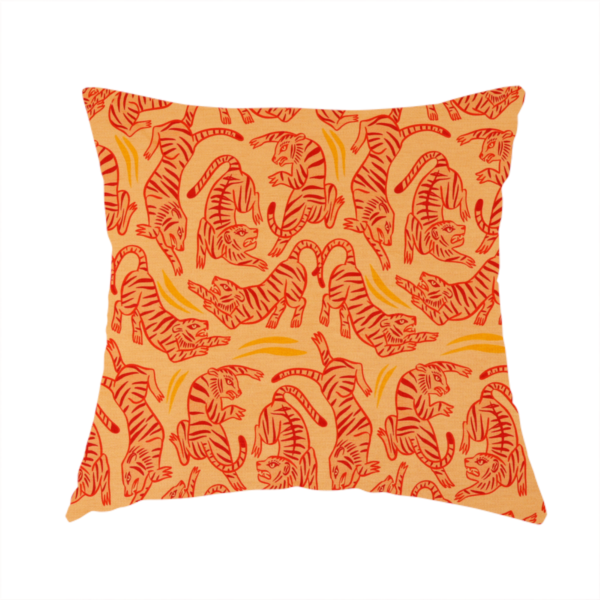 The fabric used to create this handmade cushion has a seamless illustrative pattern featuring leaping red tigers on a warm peach-toned background.