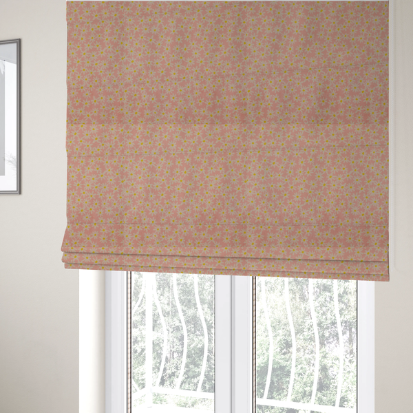The fabric used to create these Roman blinds has a seamless ditsy floral pattern featuring small white and yellow daisies on a soft peach-pink fabric background.