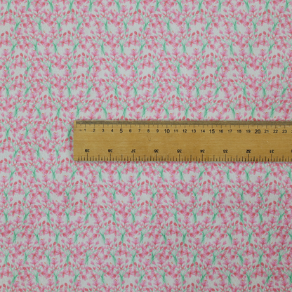 Vertical pink floral branch pattern on white fabric, featuring a delicate blossom and green stem motif.