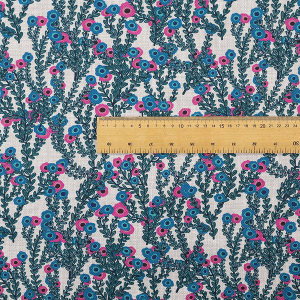 A patterned upholstery fabric with a visible cross-weave texture. The design features a repetitive botanical motif of teal vines and multi-coloured pink and blue flowers on a neutral cream base.