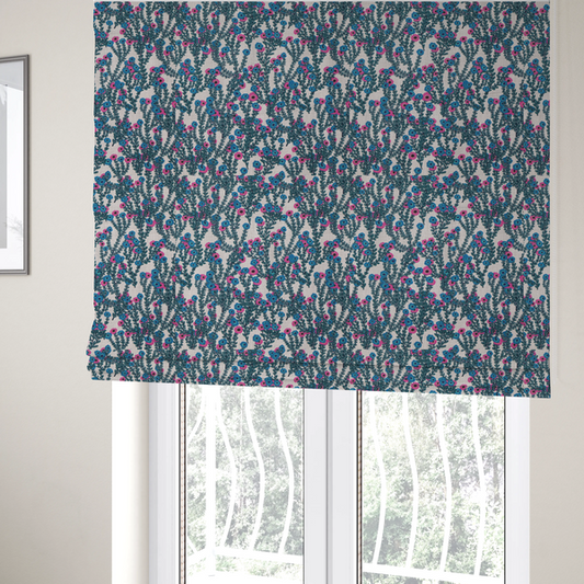 The fabric used to create these bespoke Roman blinds is a patterned upholstery fabric with a visible cross-weave texture. The design features a repetitive botanical motif of teal vines and multi-coloured pink and blue flowers on a neutral cream base.