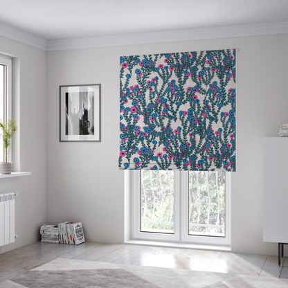 The fabric used to create these bespoke Roman blinds is a patterned upholstery fabric with a visible cross-weave texture. The design features a repetitive botanical motif of teal vines and multi-coloured pink and blue flowers on a neutral cream base.