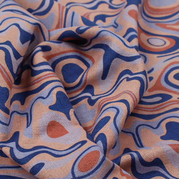 A repeating textile design with a psychedelic, mid-century modern aesthetic. The pattern consists of flowing, organic "liquid" lines and nested concentric shapes resembling a topographical map or marbleized paper. Colours include deep navy blue, warm terracotta, soft peach, and periwinkle.