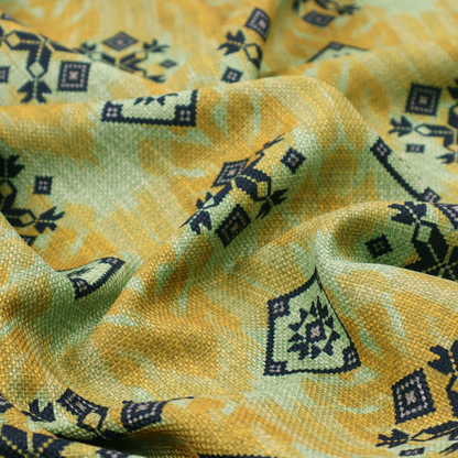 Seamless geometric pattern featuring black and charcoal medallions over a textured yellow and olive green ikat background.