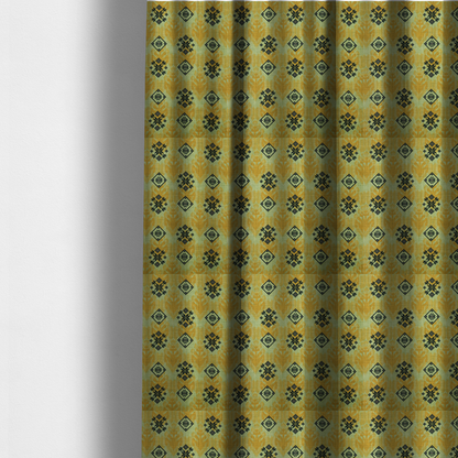 The fabric used to create these made-to-measure curtains has a seamless geometric pattern featuring black and charcoal medallions over a textured yellow and olive green ikat background.