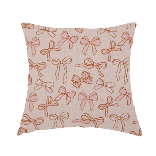 This fabric used for this cushion includes different shapes and styles of pink bows on a pink background.