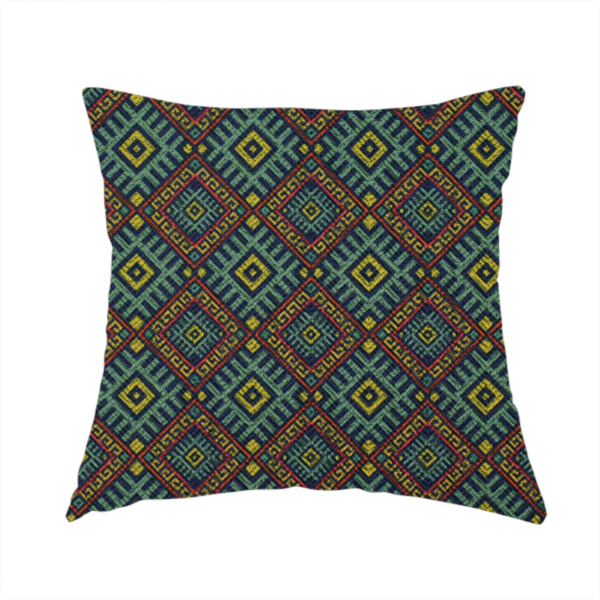 The fabric used to create this handmade cushion is a detailed woven fabric featuring a repeating geometric diamond lattice pattern in shades of teal, mustard yellow, and terracotta red.