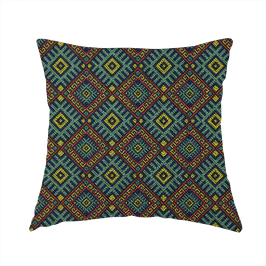 The fabric used to create this handmade cushion is a detailed woven fabric featuring a repeating geometric diamond lattice pattern in shades of teal, mustard yellow, and terracotta red.