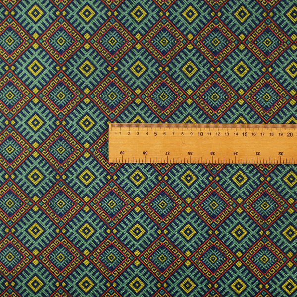 A detailed woven fabric featuring a repeating geometric diamond lattice pattern in shades of teal, mustard yellow, and terracotta red.