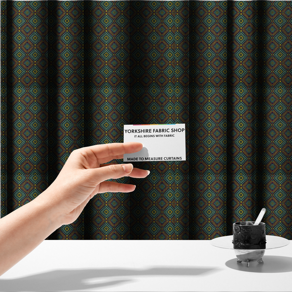 The fabric used to create these made-to-measure curtains is a detailed woven fabric featuring a repeating geometric diamond lattice pattern in shades of teal, mustard yellow, and terracotta red.