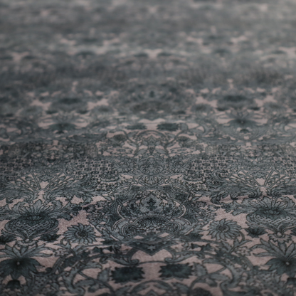 Vintage-inspired charcoal damask upholstery fabric. Ornate baroque floral pattern on a distressed slate grey background, suitable for gothic or French country home decor.
