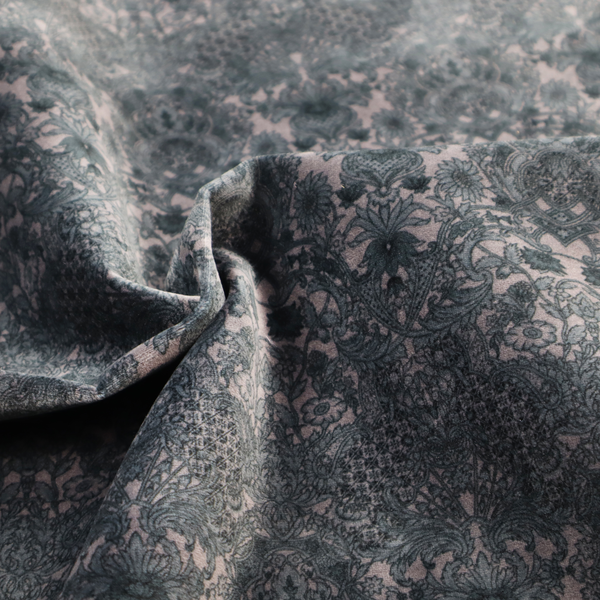 Vintage-inspired charcoal damask upholstery fabric. Ornate baroque floral pattern on a distressed slate grey background, suitable for gothic or French country home decor.