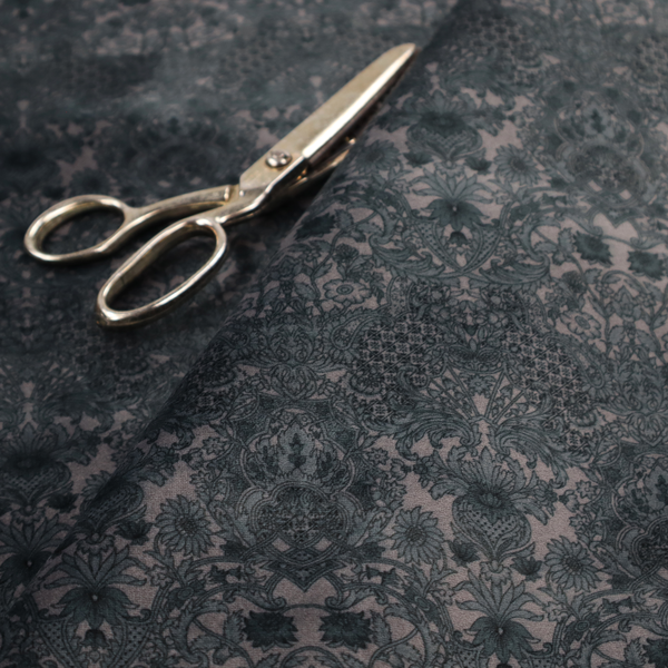 Vintage-inspired charcoal damask upholstery fabric. Ornate baroque floral pattern on a distressed slate grey background, suitable for gothic or French country home decor.