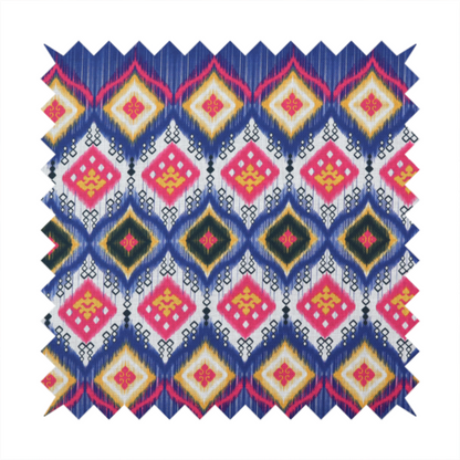 A high-energy textile with a large-scale geometric Ikat design. The pattern showcases concentric diamonds with feathered, "blurred" edges in electric blue, bright pink, and yellow, set against a background with vertical white striations.