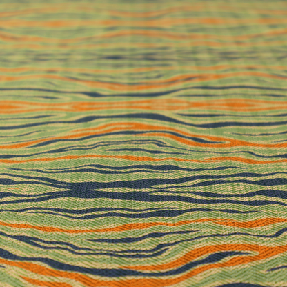 A woven fabric featuring a repeating horizontal wavy pattern in burnt orange, navy blue, and sage green.