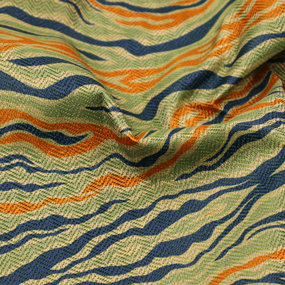 A woven fabric featuring a repeating horizontal wavy pattern in burnt orange, navy blue, and sage green.