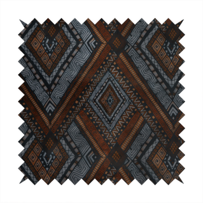Intricate textile design with a repeating diamond and chevron motif. The pattern features fine, hand-inked linework, including Greek key patterns and zig-zags. The colour palette is a moody mix of earthy terracotta, deep grey, and black, giving it a rustic, bohemian feel.