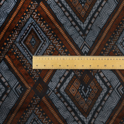 Intricate textile design with a repeating diamond and chevron motif. The pattern features fine, hand-inked linework, including Greek key patterns and zig-zags. The colour palette is a moody mix of earthy terracotta, deep grey, and black, giving it a rustic, bohemian feel.