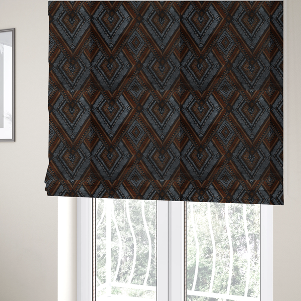 The fabric used to create these bespoke Roman blinds is a intricate textile design with a repeating diamond and chevron motif. The pattern features fine, hand-inked linework, including Greek key patterns and zig-zags. The colour palette is a moody mix of earthy terracotta, deep grey, and black, giving it a rustic, bohemian feel.