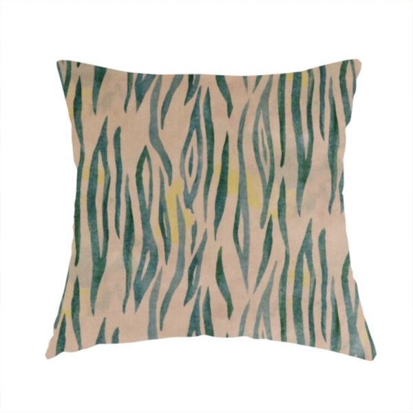 The fabric used to create this handmade cushion is a vertical hand-painted stripes resembling an organic animal print. The design features soft, bleeding edges in various shades of green and muted teal over a warm sandstone or blush background, accented with small pops of yellow.