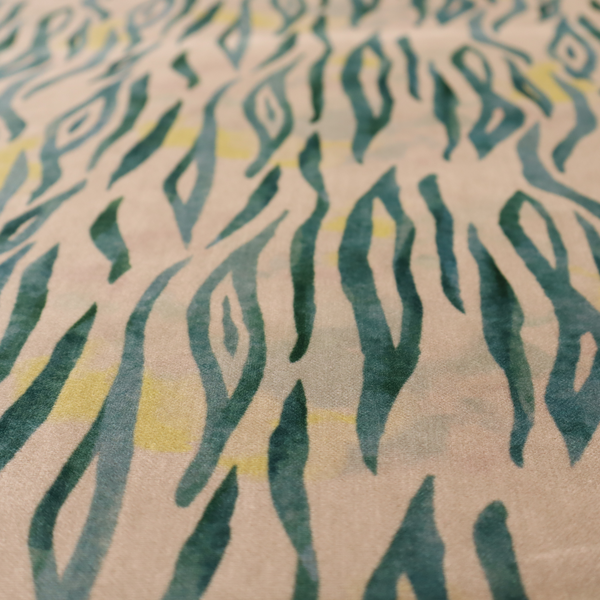 Vertical hand-painted stripes resembling an organic animal print. The design features soft, bleeding edges in various shades of green and muted teal over a warm sandstone or blush background, accented with small pops of yellow.