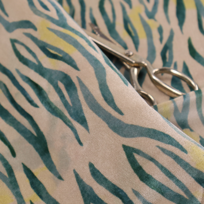 Vertical hand-painted stripes resembling an organic animal print. The design features soft, bleeding edges in various shades of green and muted teal over a warm sandstone or blush background, accented with small pops of yellow.