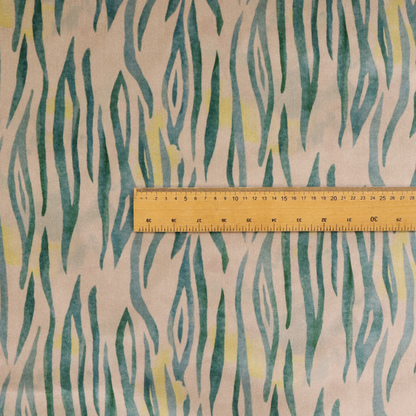 Vertical hand-painted stripes resembling an organic animal print. The design features soft, bleeding edges in various shades of green and muted teal over a warm sandstone or blush background, accented with small pops of yellow.