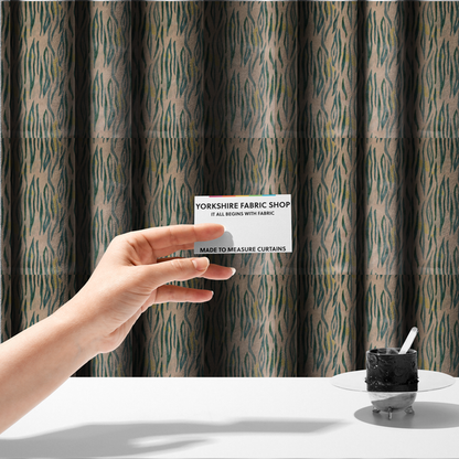The fabric used to create these made-to-measure curtains is a vertical hand-painted stripes resembling an organic animal print. The design features soft, bleeding edges in various shades of green and muted teal over a warm sandstone or blush background, accented with small pops of yellow.