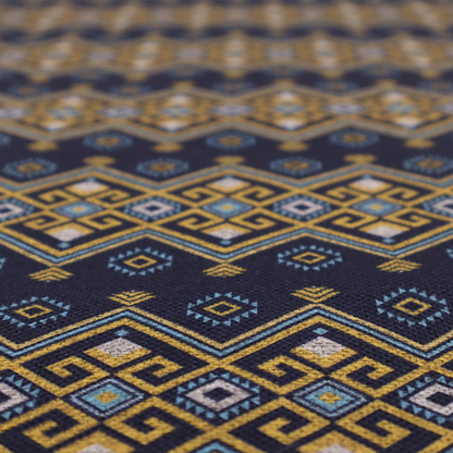 A horizontal Southwestern-inspired geometric pattern featuring navy blue bands with mustard yellow and sky blue interlocking diamonds and Greek key motifs.
