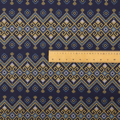 A horizontal Southwestern-inspired geometric pattern featuring navy blue bands with mustard yellow and sky blue interlocking diamonds and Greek key motifs.