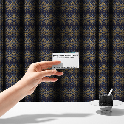 The fabric used to create these made-to-measure curtains is a horizontal Southwestern-inspired geometric pattern featuring navy blue bands with mustard yellow and sky blue interlocking diamonds and Greek key motifs.