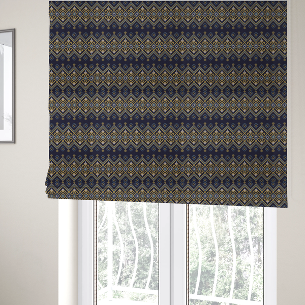 The fabric used to create these Roman blinds is a horizontal Southwestern-inspired geometric pattern featuring navy blue bands with mustard yellow and sky blue interlocking diamonds and Greek key motifs.
