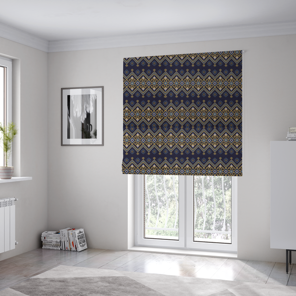 The fabric used to create these Roman blinds is a horizontal Southwestern-inspired geometric pattern featuring navy blue bands with mustard yellow and sky blue interlocking diamonds and Greek key motifs.