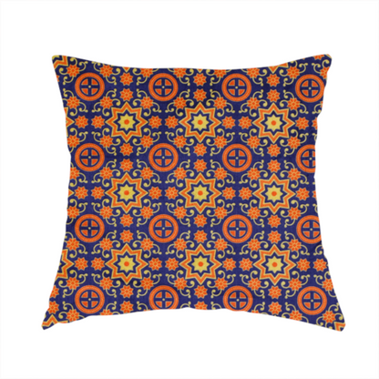 The fabric used to create this cushion is a repeating celestial geometric pattern featuring eight-pointed orange stars and circular cross motifs set against a deep navy blue background with yellow filigree.