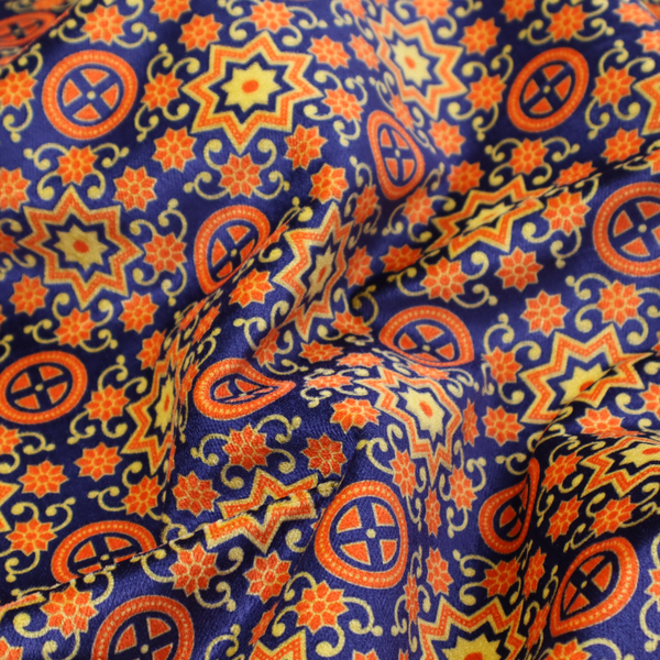 A repeating celestial geometric pattern featuring eight-pointed orange stars and circular cross motifs set against a deep navy blue background with yellow filigree.