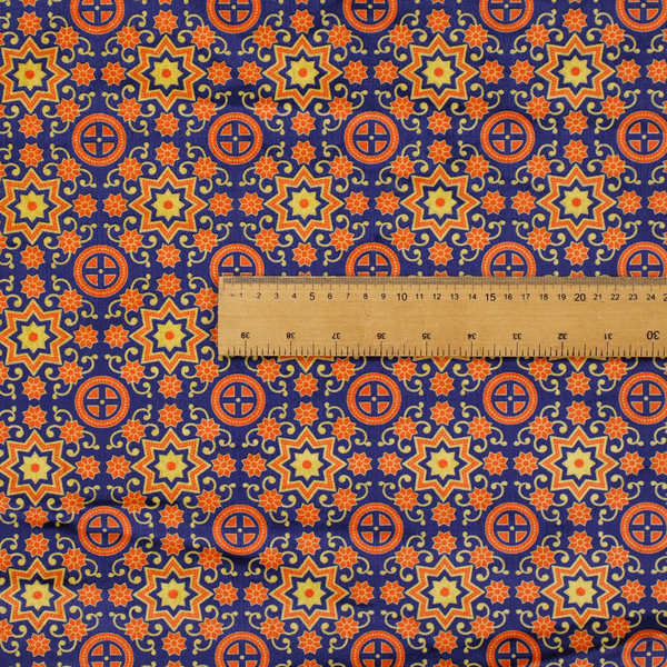 A repeating celestial geometric pattern featuring eight-pointed orange stars and circular cross motifs set against a deep navy blue background with yellow filigree.