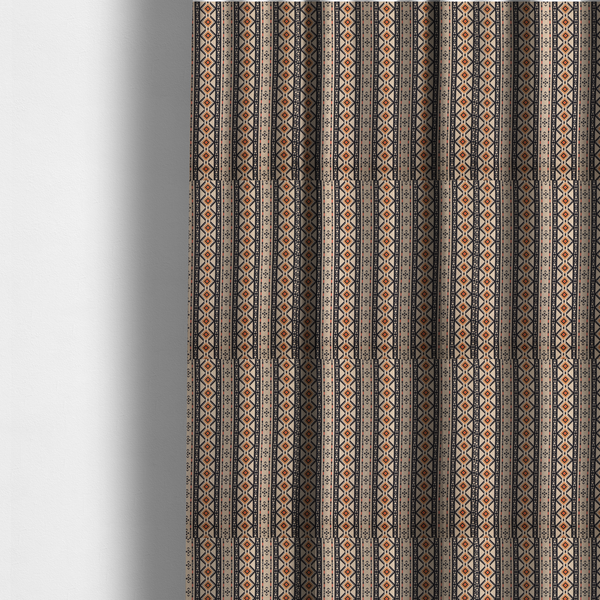 The fabric used to create these made-to-measure curtains is a intricate tribal border print arranged in vertical columns on a visually textured, linen-look base. The design includes repeating rows of rust-orange diamonds, black zig-zags, and arrow-like geometric motifs with a hand-drawn aesthetic.